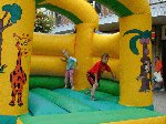 The kids enjoy the bouncy castle whilst listening to the YDR FM Roadshow.

The Liberal Club, Yeovil, 04-Aug-2001.