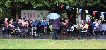 The Kingsbury Band play for the crowd - at least their instruments won't rust !!!

Fete at Sydney Gardens, Yeovil, 18-Aug-2001